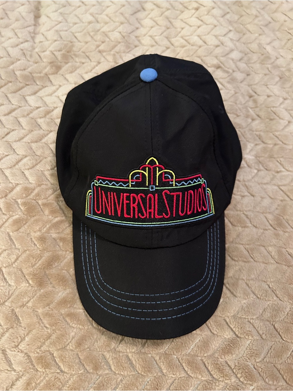 Universal Black Baseball Cap with White Text and Red Accent